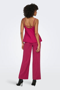 Back image of a model wearing the Madeli oaklyn strap top in fuschia, by brand Only