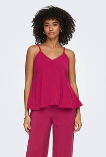 Front image of a model wearing the Madeli oaklyn strap top in fuschia, by brand Only