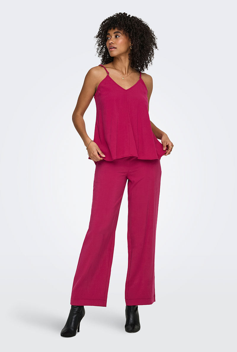 Front image of a model wearing Madeli oaklyn strap top in fuschia, by brand Only