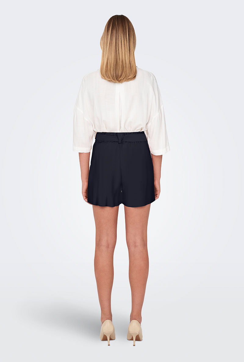 Back image of a model wearing Only nova life talia shorts in navy, by brand Only
