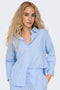 Pocket detail image of a model wearing the Augusta s/s shirt in light blue, by brand Only