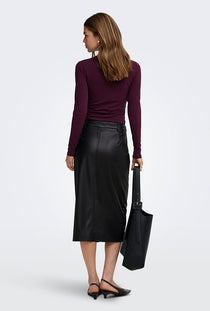 Back image of a model wearing the Bitten faux leather pencil skirt in black, by brand Only