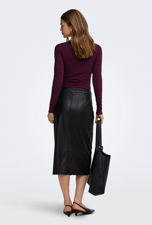 Back image of a model wearing the Bitten faux leather pencil skirt in black, by brand Only