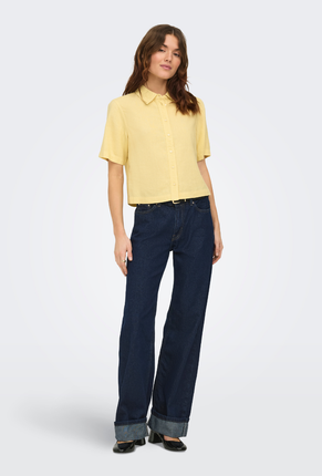 Front image of a model wearing Goa shortsleeve linen shirt in yellow, by brand Only