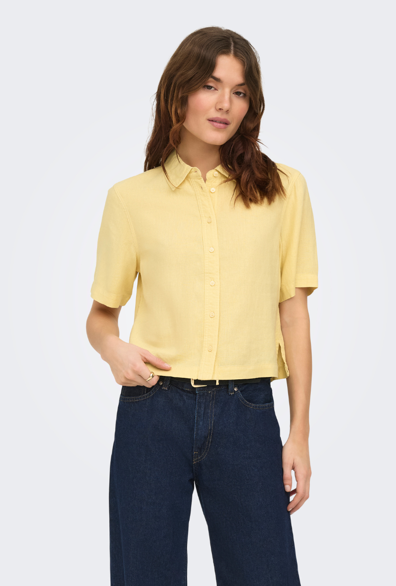 Front image of a model wearing Goa shortsleeve linen shirt in yellow, by brand Only