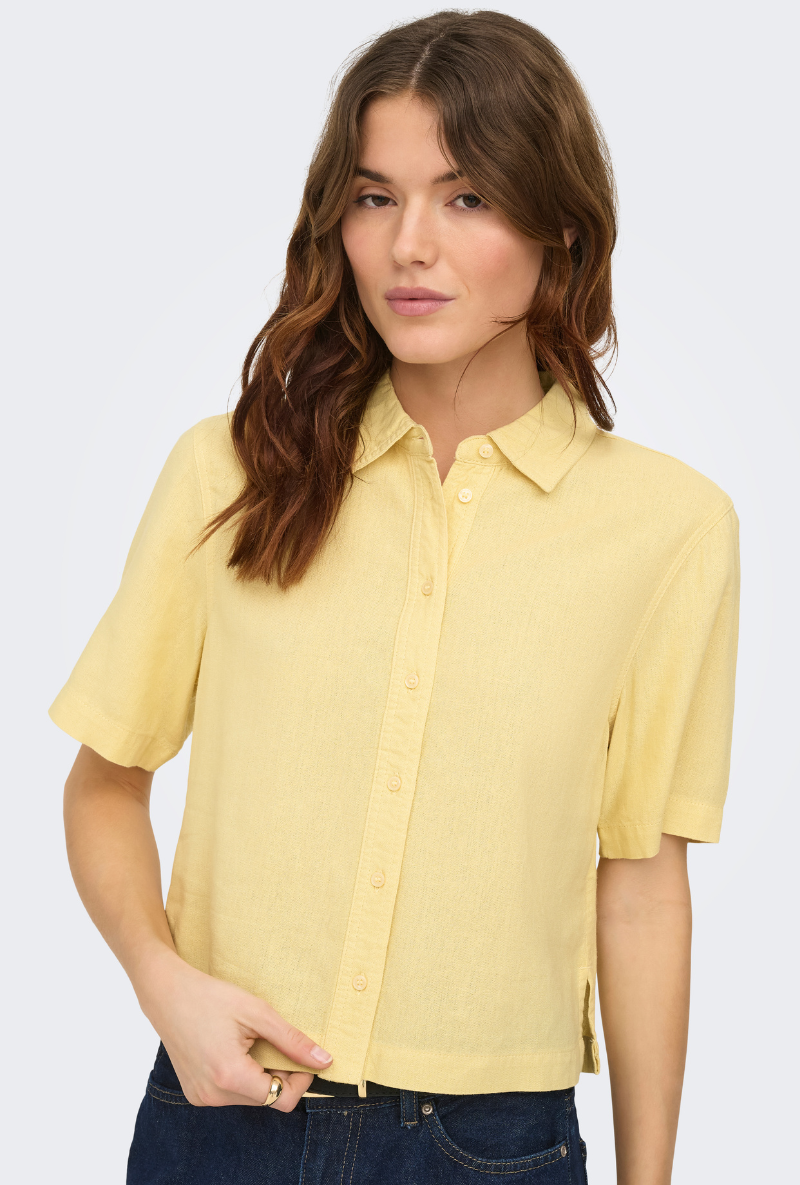 Front image of a model wearing Goa shortsleeve linen shirt in yellow, by brand Only