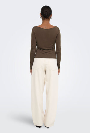 Back image of a model wearing the Hannah l/s metal top in brown, by brand Only