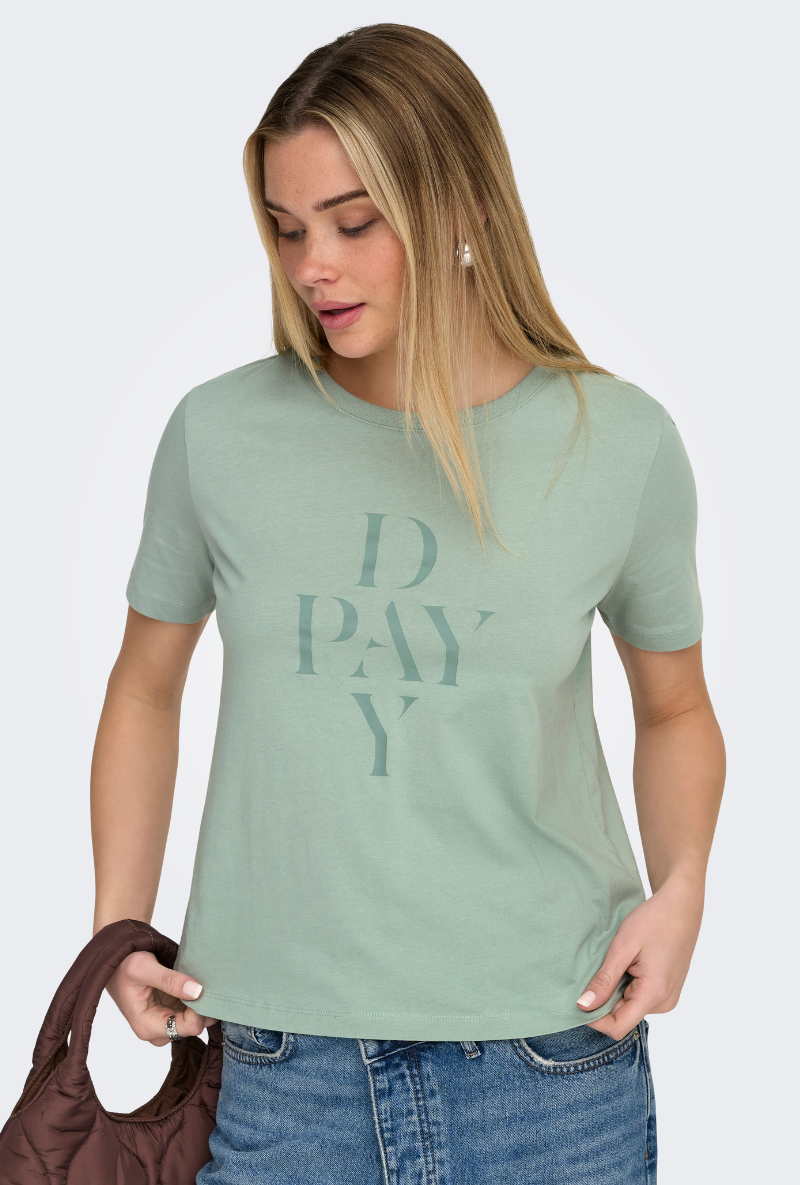 Front image of a model wearing Only happy s/s print top in sage, by brand Only