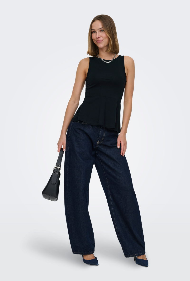 Front image of a model wearing Kiss sleeveless peplum top in black, by brand Only