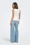 Back image of a model wearing the Kiss sleeveless peplum top in white, by brand Only