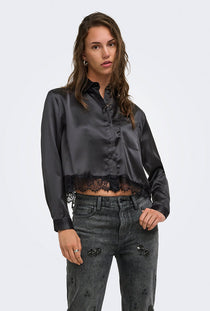 Front image of a model wearing the Lindona l/s satin lace shirt in black, by brand Only