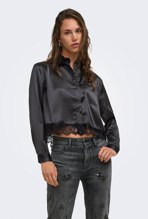 Front image of a model wearing the Lindona l/s satin lace shirt in black, by brand Only