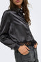 Front image of a model wearing the Lindona l/s satin lace shirt in black, by brand Only