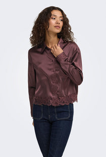 Front image of a model wearing the Lindona l/s satin lace shirt in chocolate, by brand Only