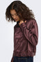 Front image of a model wearing the Lindona l/s satin lace shirt in chocolate, by brand Only