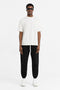 Front image of a model wearing the Initial oversized t in off white, by brand Represent