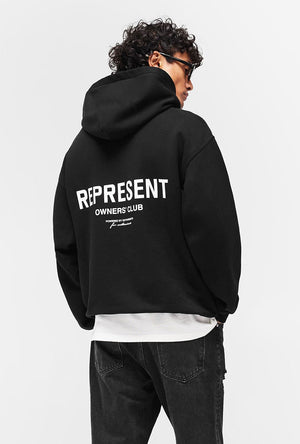 Back image of a model wearing the Owners club hoodie in black, by brand Represent