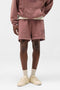 Front image of a model wearing Owners club script mesh shorts in brown, by brand Represent