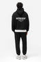 Back image of a model wearing the Owners club sweatpant in black, by brand Represent