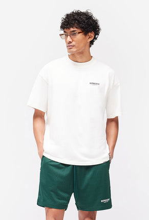 Front image of a model wearing Owners club t in off white, by brand Represent