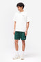 Front image of a model wearing the Owners club t in off white, by brand Represent