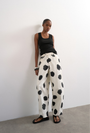 Image of YARA HIGHRISE DOT BARREL TROUSERS in white, by brand TOP SHOP