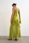 Back image of a model wearing the Annika ruffle maxi dress in green, by brand Top shop