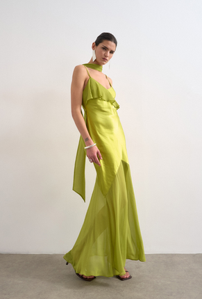 Front image of a model wearing Annika ruffle maxi dress in green, by brand Top shop