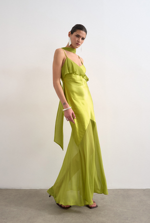 Front image of a model wearing the Annika ruffle maxi dress in green, by brand Top shop