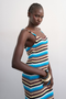 Front image of a model wearing the Cajsa sleeveless multi striped knit dress in blue, by brand Top shop