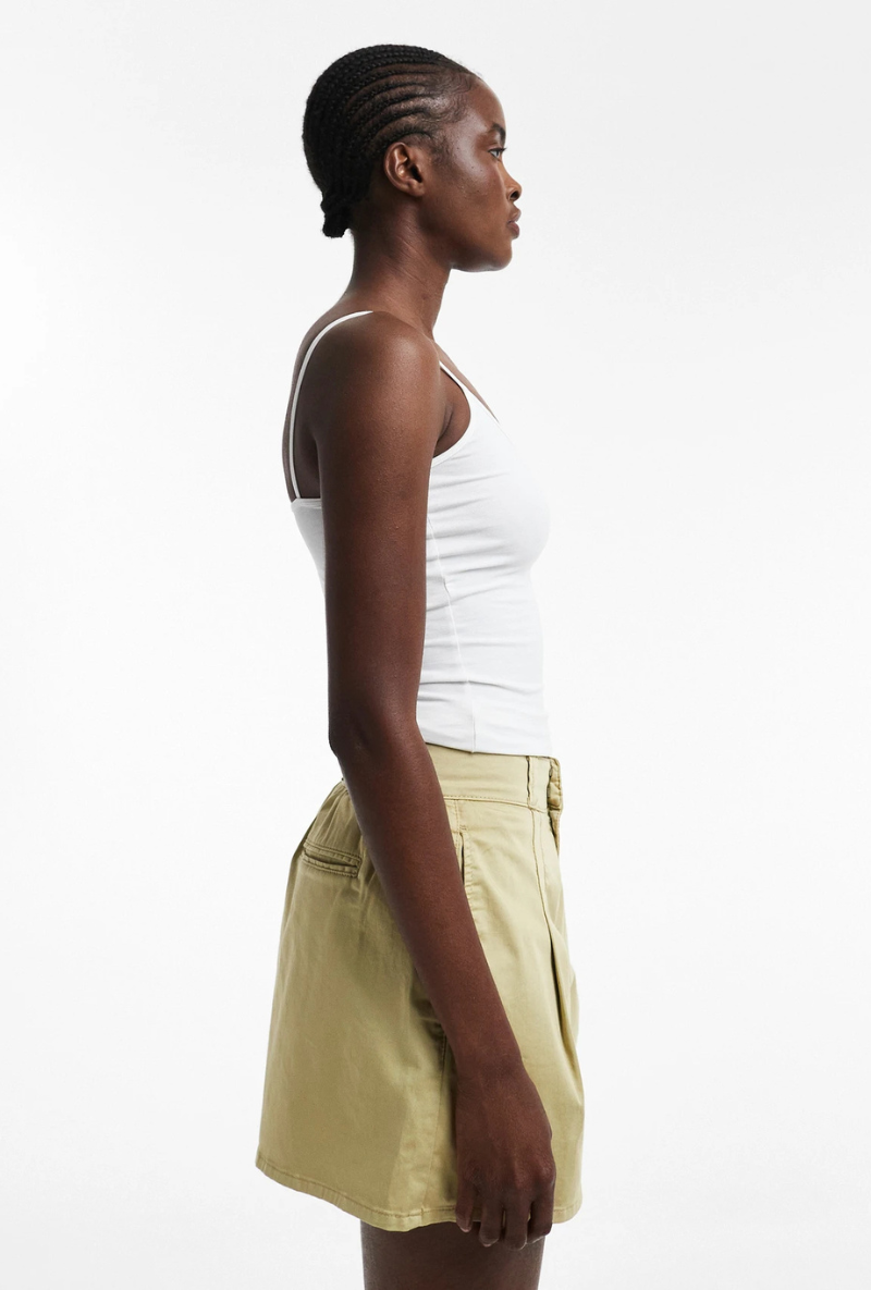Front detail image of a model wearing Eva a line shorts in sage, by brand Top shop
