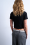 Back image of a model wearing the Everyday crop top in black, by brand Top shop