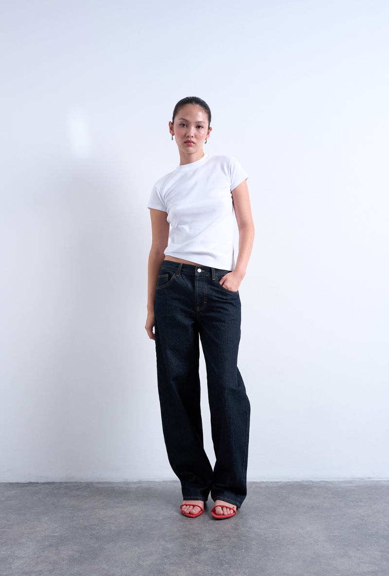 Front image of a model wearing Everyday top in white, by brand Top shop
