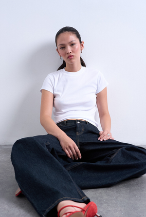 Front image of a model wearing the Everyday top in white, by brand Top shop