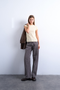 Front image of a model wearing Everyday top in yellow, by brand Top shop