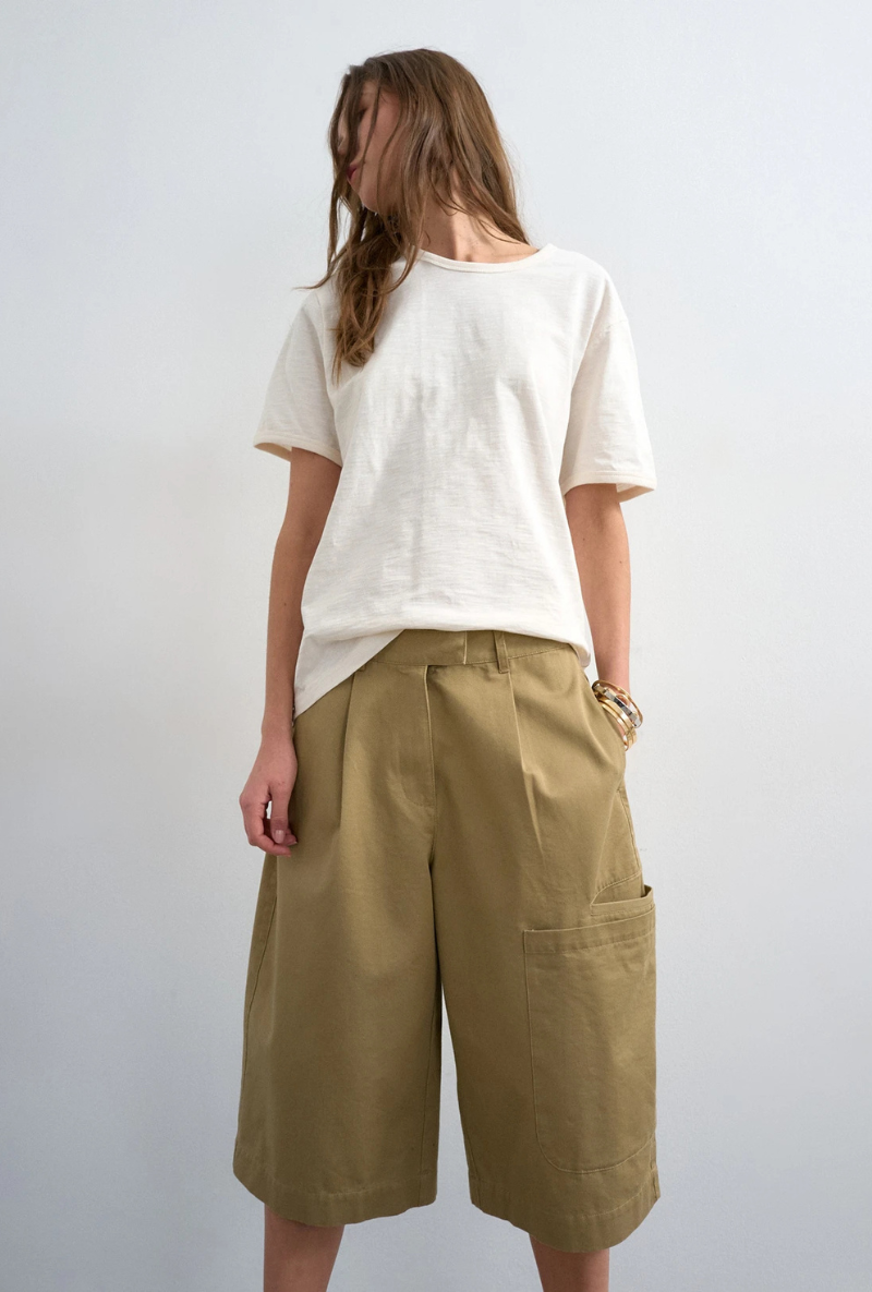 Front image of a model wearing Femke longline cargo shorts in tan, by brand Top shop