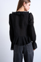 Back image of a model wearing the Fiona ruffle top in black, by brand Top shop
