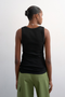 Back image of a model wearing the Honey vest in black, by brand Top shop