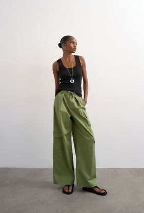 Front image of a model wearing Honey vest in black, by brand Top shop