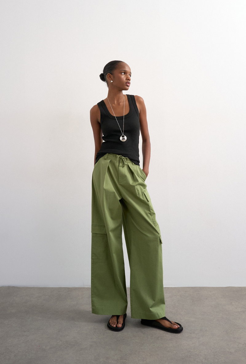 Front image of a model wearing Honey vest in black, by brand Top shop