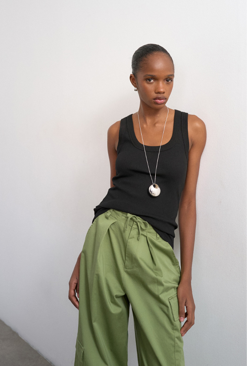 Front image of a model wearing Honey vest in black, by brand Top shop