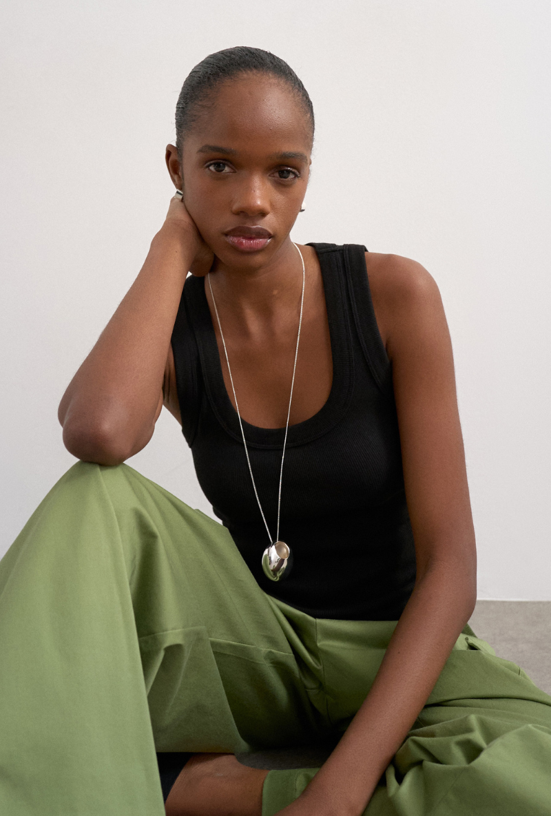 Front image of a model wearing Honey vest in black, by brand Top shop
