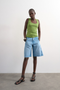 Front image of a model wearing Honey vest in green, by brand Top shop