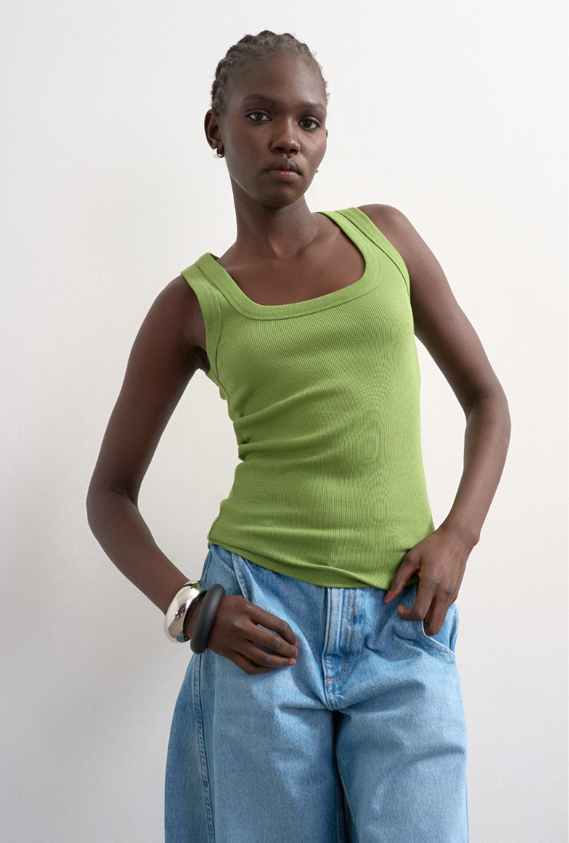 Front image of a model wearing Honey vest in green, by brand Top shop