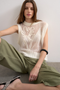 Front image of a model wearing the Josephine emb o in off white, by brand Top shop