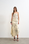 Front image of a model wearing Mani asymmetric slip skirt in cream, by brand Top shop