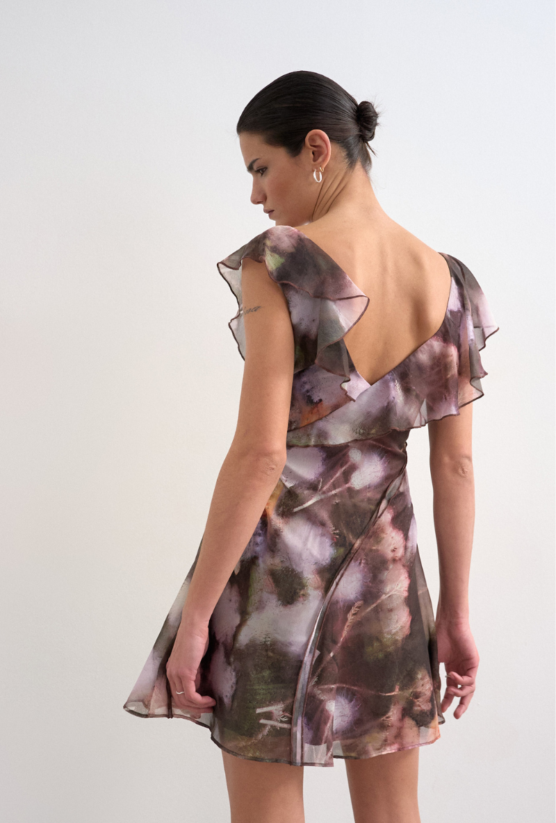 Back image of a model wearing Rikke ruffle mini dress in brown, by brand Top shop
