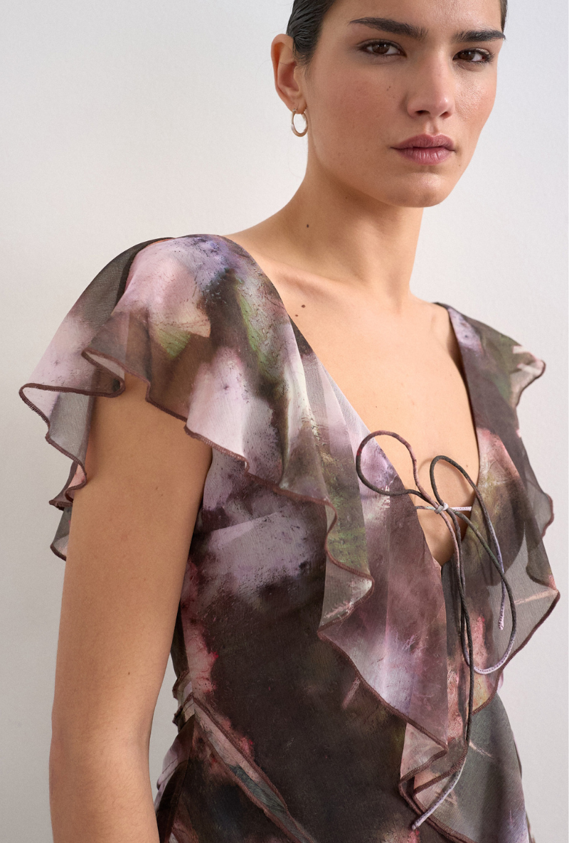 Front image of a model wearing Rikke ruffle mini dress in brown, by brand Top shop