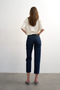 Back image of a model wearing the Runway cropped jeans in dark denim, by brand Top shop