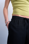 Front detail image of a model wearing the Lakia straight trouser in black, by brand Top shop